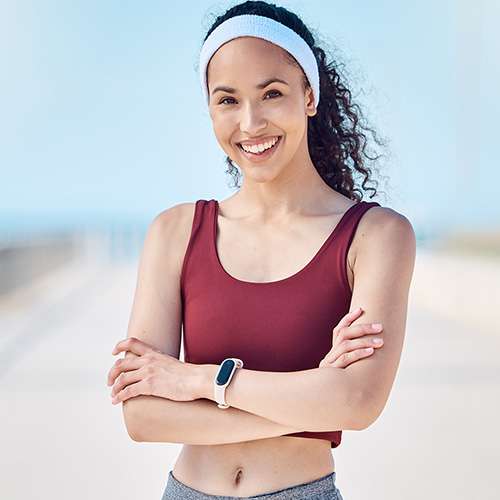 happy-woman-portrait-and-fitness-with-arms-crosse-2023-11-27-05-07-30-utc.jpg